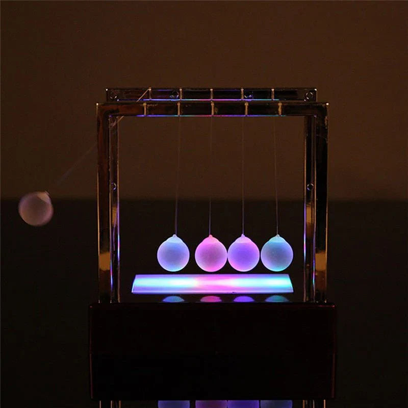 Newton’s Cradle LED Light-Up Kinetic Energy Toy – Home & Office Decor  لعبة نيوتن المضيئة بالطاقة الحركية – ديكور للمكتب والمنزل