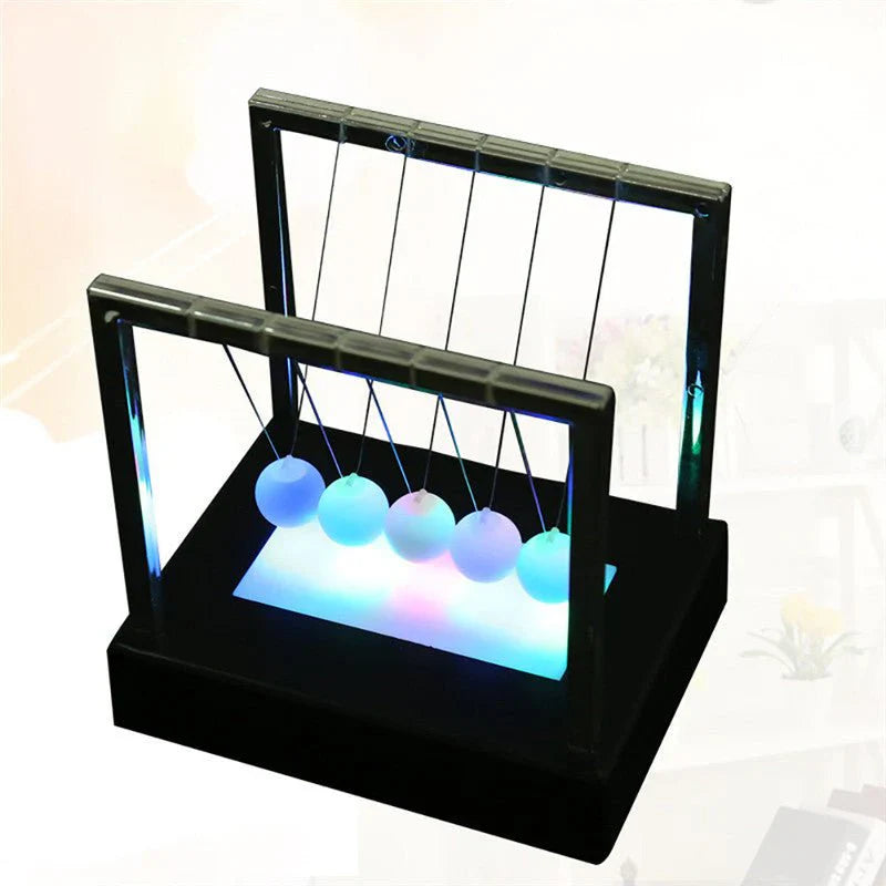 Newton’s Cradle LED Light-Up Kinetic Energy Toy – Home & Office Decor  لعبة نيوتن المضيئة بالطاقة الحركية – ديكور للمكتب والمنزل